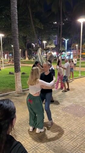 Evening dancing and beach activities captured in Nha Trang Vietnam