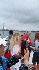 Group celebrates aboard decorated boat near Turkish coast