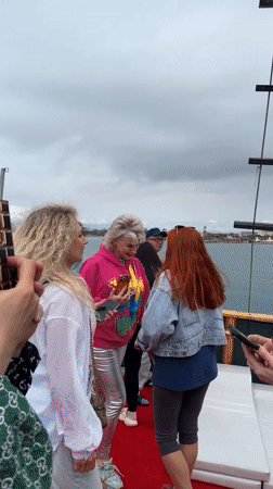 Group celebrates aboard decorated boat near Turkish coast