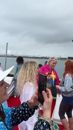Group celebrates aboard decorated boat near Turkish coast