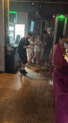 Dancing and gathering at a dim indoor venue in Varna