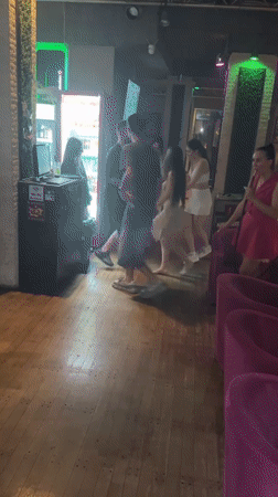 Dancing and gathering at a dim indoor venue in Varna