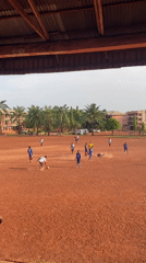 Soccer match played on red dirt field in Abakaliki