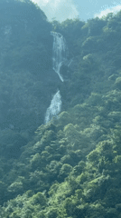 Driver captures waterfall views during Sa Pa mountain journey
