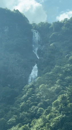 Driver captures waterfall views during Sa Pa mountain journey