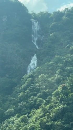 Driver captures waterfall views during Sa Pa mountain journey
