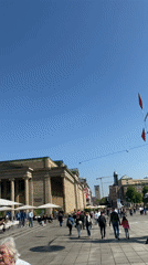 Historical costume procession marches through downtown Stuttgart on sunny Saturday