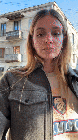 Woman photographed at multiple Tbilisi locations during brief timespan