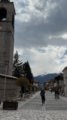 Spring day captured on cobblestone street in Bansko, Bulgaria