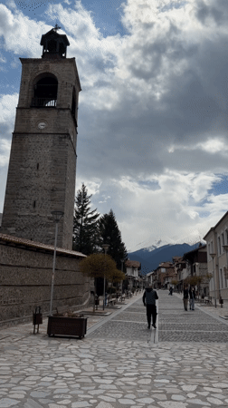 Spring day captured on cobblestone street in Bansko, Bulgaria