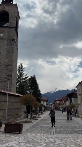 Spring day captured on cobblestone street in Bansko, Bulgaria