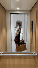 Woman Takes Selfie in Hotel Elevator in Budva