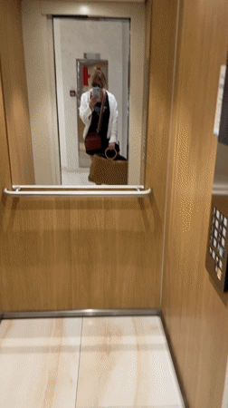 Woman Takes Selfie in Hotel Elevator in Budva