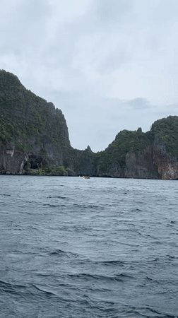 Choppy waters and limestone cliffs captured in Ao Nang