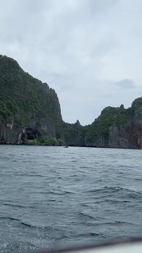 Choppy waters and limestone cliffs captured in Ao Nang