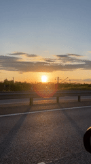 Sunset observed over Russian countryside from moving vehicle