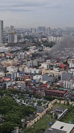 Thick smoke rises from a Makati building fire