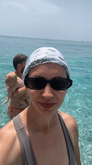 Woman takes selfie in turquoise waters off Fethiye beach