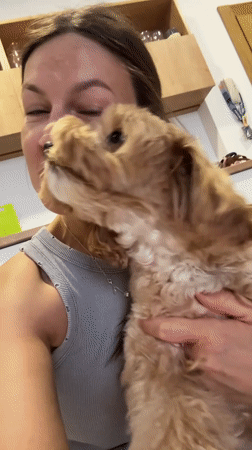 Woman shares affectionate moment with small dog in Montenegro