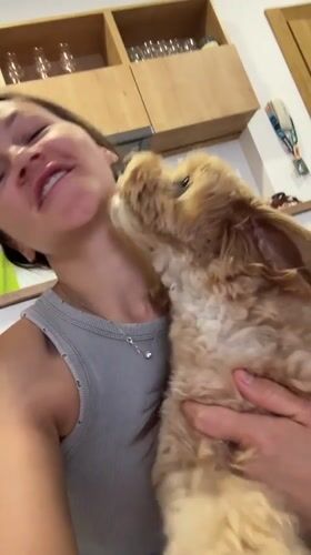 Woman shares affectionate moment with small dog in Montenegro