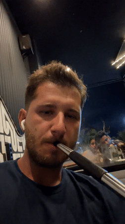 Tourist documents evening outing through North Kuta, Indonesia