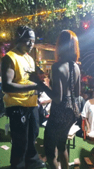 Outdoor nighttime party draws dancing crowds in Nnewi, Nigeria