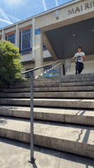 Scooter tricks performed on Lyon sidewalk and stairwell