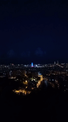 Barcelona building displays blue and red lighting at night