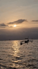 Bali beaches at golden hour, boats, paddleboards, and sunset clouds