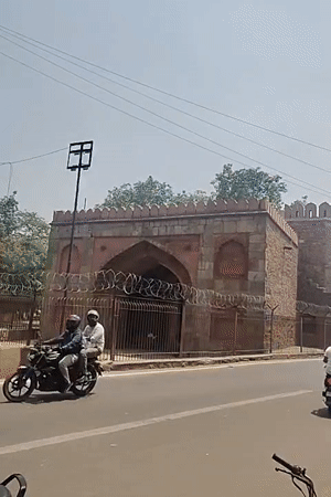 Delhi morning scenes: historic gate and urban architecture documented
