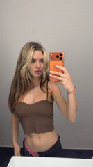Woman takes mirror selfies in Berlin bathroom