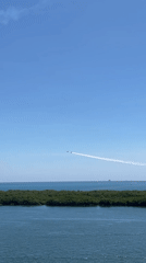 Aircraft formation spotted over coastal waterfront area