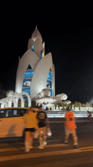 Illuminated monument filmed at night in Nha Trang, Vietnam
