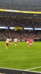 Soccer match underway at a packed Yankee Stadium