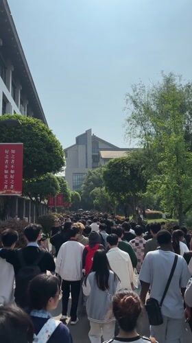 Large crowd walks university campus in Jiangjin at night
