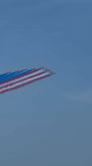 Red, white, and blue smoke trails over New York on July 4th