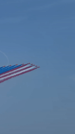 Red, white, and blue smoke trails over New York on July 4th