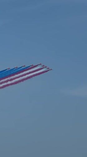 Red, white, and blue smoke trails over New York on July 4th
