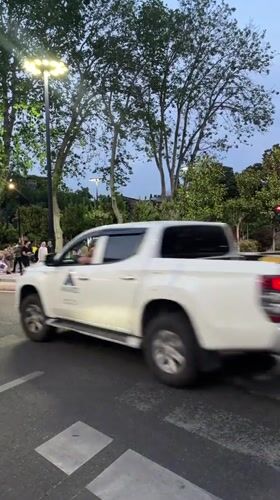 Regular traffic and pedestrians observed at Tbilisi intersection
