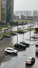 Heavy flooding swamps Russian streets as vehicles push through