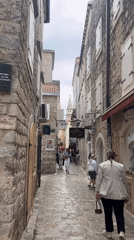 Morning street activity recorded in historic Budva district