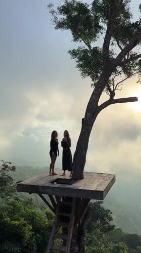 Two women visit mountain tree platform in Abang, Indonesia