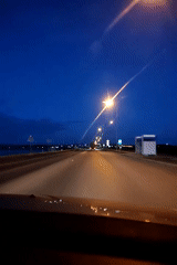 Sunset drive captured along waterfront roads in Chaikovsky, Russia