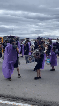 Costumed parade with drummers marches through Ushuaia, Argentina