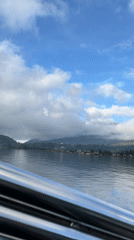 Boat journey recorded on Indonesian lake near mountains