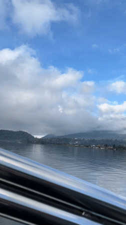 Boat journey recorded on Indonesian lake near mountains