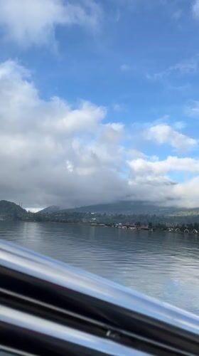 Boat journey recorded on Indonesian lake near mountains