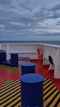 Ship deck and open sea at dusk, North Sea