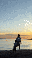 Mother and child enjoy sunset beach moment together