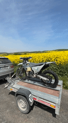 Dirt bike numbered 365 transported by trailer in Bulgaria